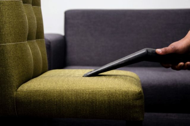 Extraction nozzle on the seat of a fabric armchair