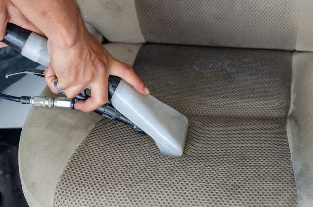 Professional extractor on upholstery fabric